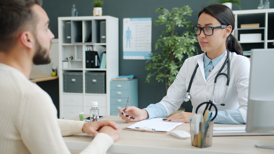 Doctor consulting with patient