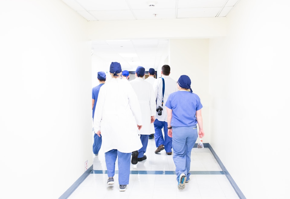Medical team walking through hospital