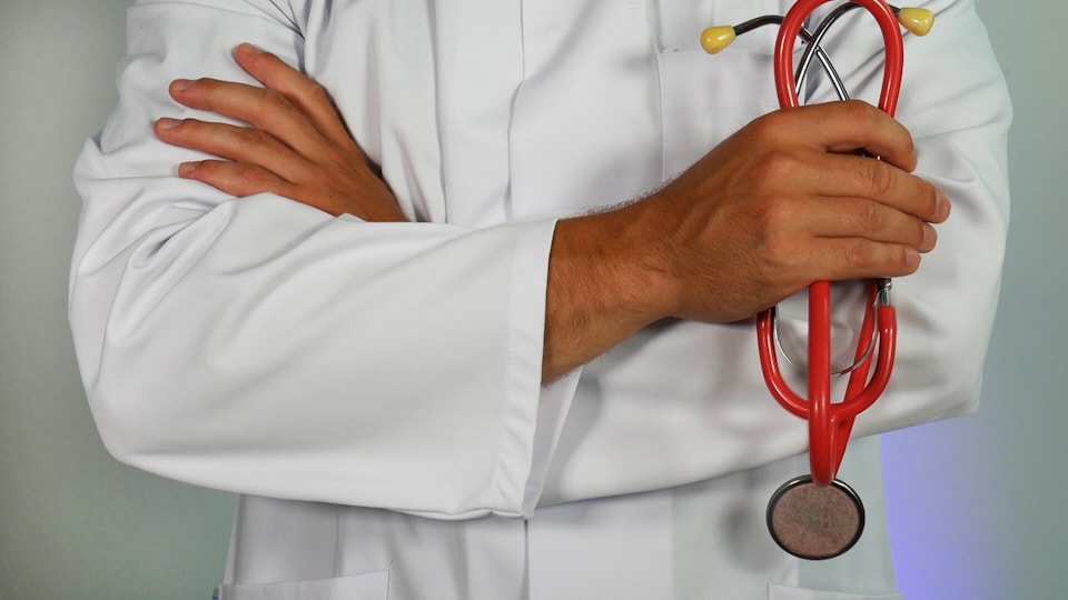 Doctor with stethoscope ready for consultation